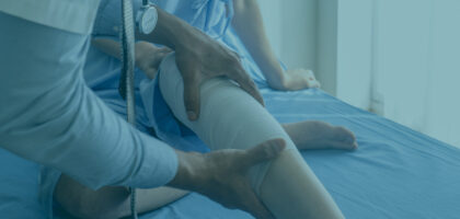 Physical Doctor consulting with patient knee problems physical therapy.